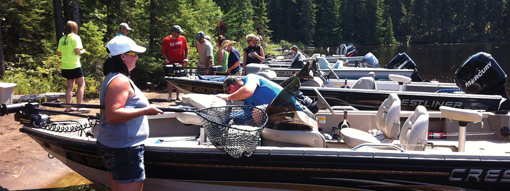 Vacationers Enjoying Boating and Fishing